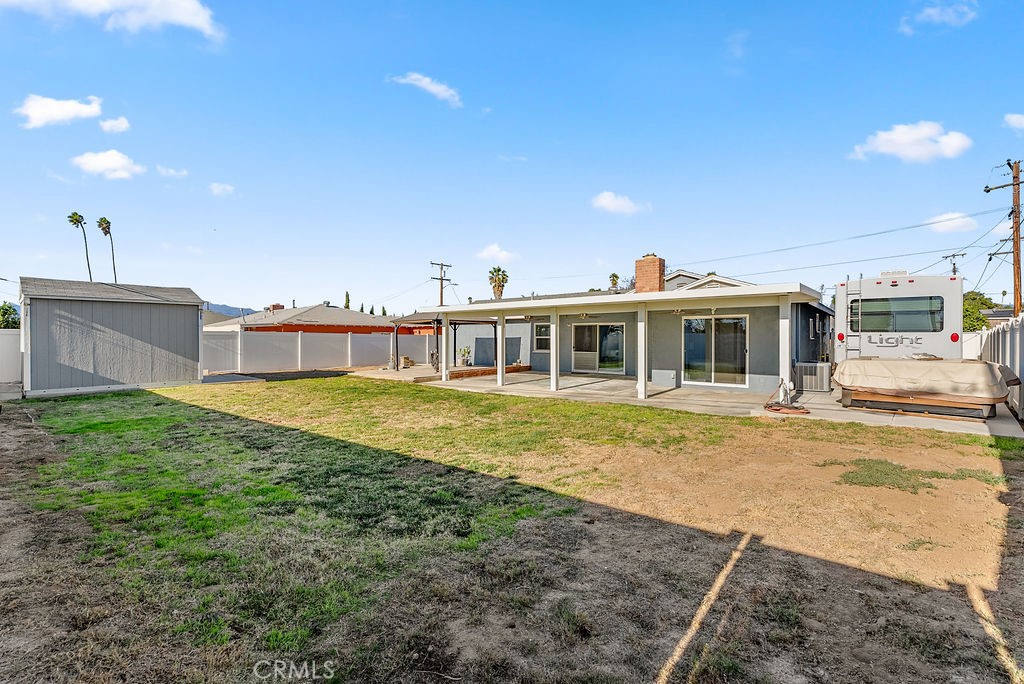3540 Cannes Avenue Riverside, CA 92501 - Photo 29 of 32 a front view of a house with a yard