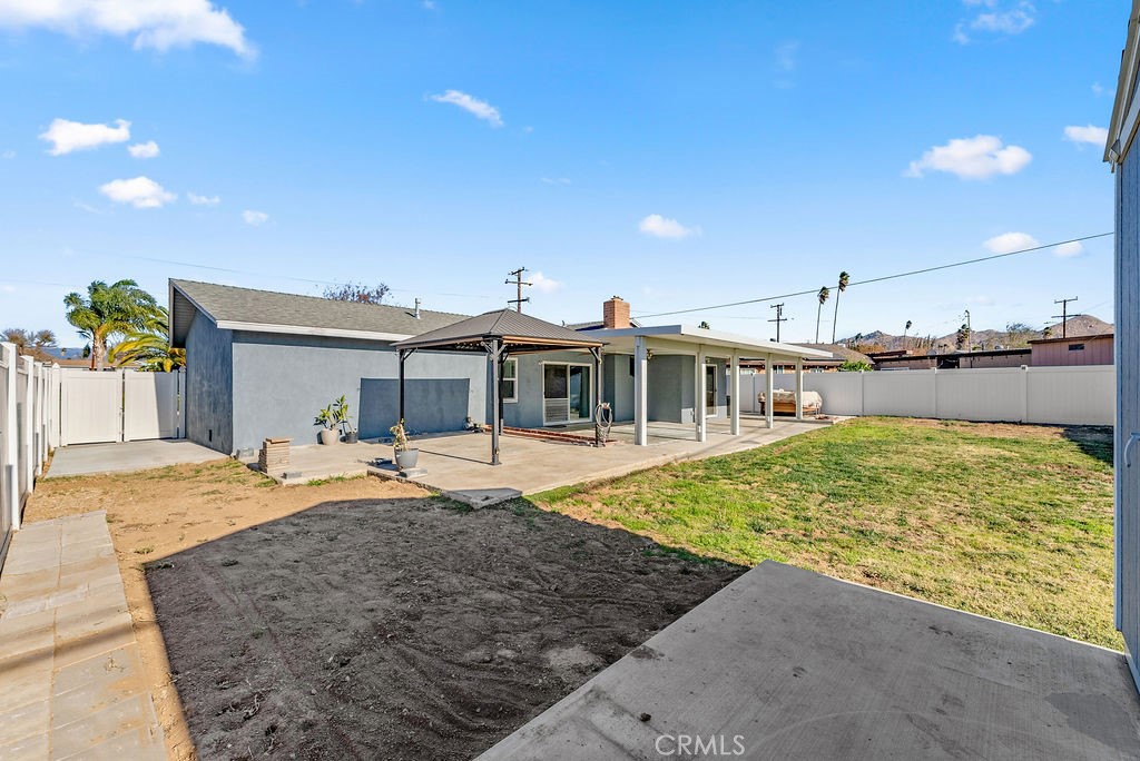 3540 Cannes Avenue Riverside, CA 92501 - Photo 30 of 32 a front view of a house with a yard