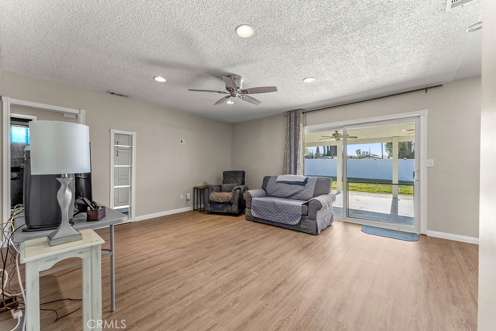 3540 Cannes Avenue Riverside, CA 92501 - Photo 5 of 32 a living room with furniture and a fireplace