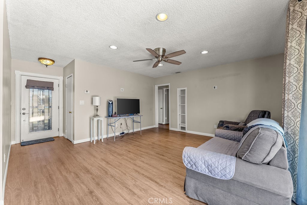 3540 Cannes Avenue Riverside, CA 92501 - Photo 6 of 32 a living room with furniture and flat screen tv