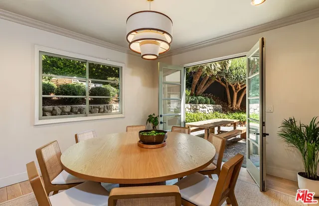 a dining room with furniture window and outside view