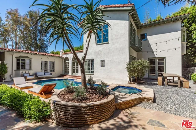 a front view of a house with swimming pool