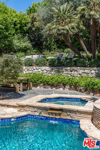 a view of yard with outdoor space and swimming pool