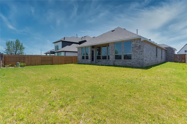 a view of a lake in front of house with a yard