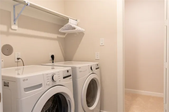 a view of storage and utility room with washer and dryer
