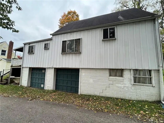 a front view of a house with a garage
