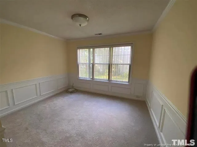 an empty room with a empty space and windows