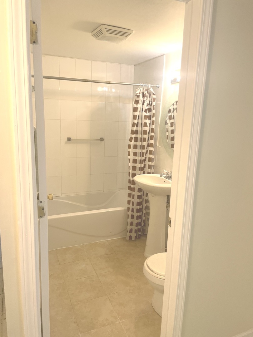 Undisclosed Address Forest Park, IL 60130 - Photo 10 of 16 a bathroom with a granite countertop shower and a toilet
