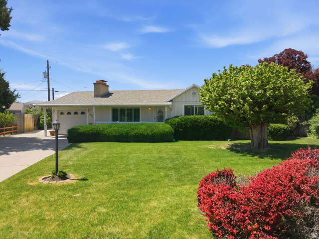 148 Tennyson Avenue Sandy, UT 84070 - Photo 47 of 55 Single-story residence featuring a front lawn with mature trees and established landscaping