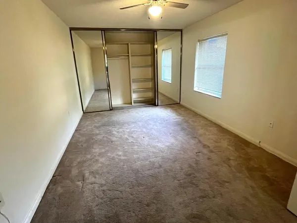 an empty room with a empty space and a window