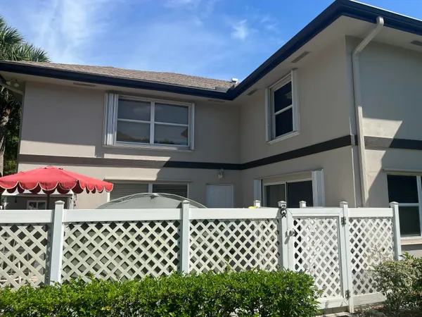 a view of house with a small yard