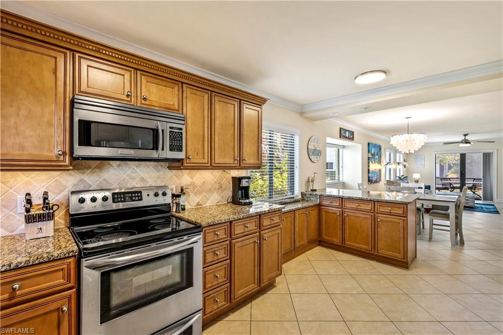 910 Vanderbilt Beach Road, Unit 311W Naples, FL 34108 - Photo 4 of 17 Kitchen area looking towards the open Living/Dining area