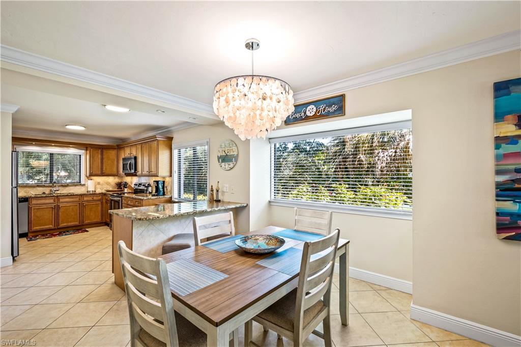 910 Vanderbilt Beach Road, Unit 311W Naples, FL 34108 - Photo 6 of 17 Dining area looking towards the large Kitchen area