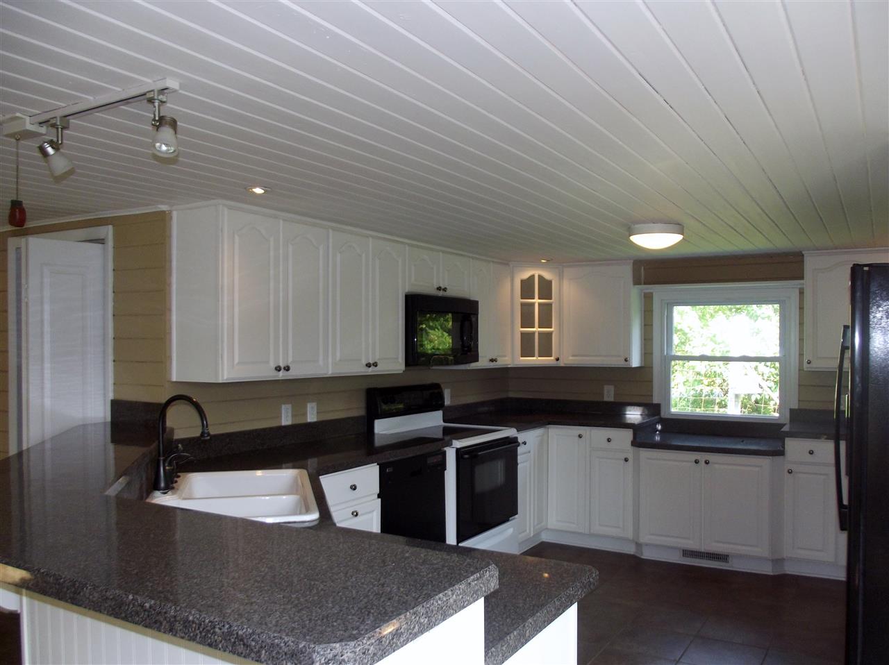 7597 Goods Mill Road Harrisonburg, VA 22801 - Photo 3 of 23 a kitchen with a sink and a stove top oven