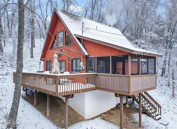 a living room with furniture a rug and a fireplace
