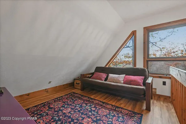 a view of a chairs and table in the balcony