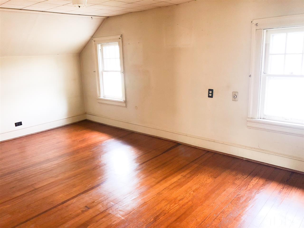 894 Shiloh Church Road Roxboro, NC 27574 - Photo 13 of 24 an empty room with wooden floor and windows