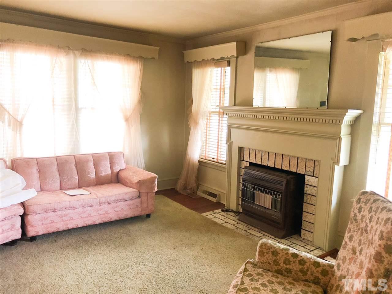 894 Shiloh Church Road Roxboro, NC 27574 - Photo 3 of 24 a living room with furniture and a fireplace