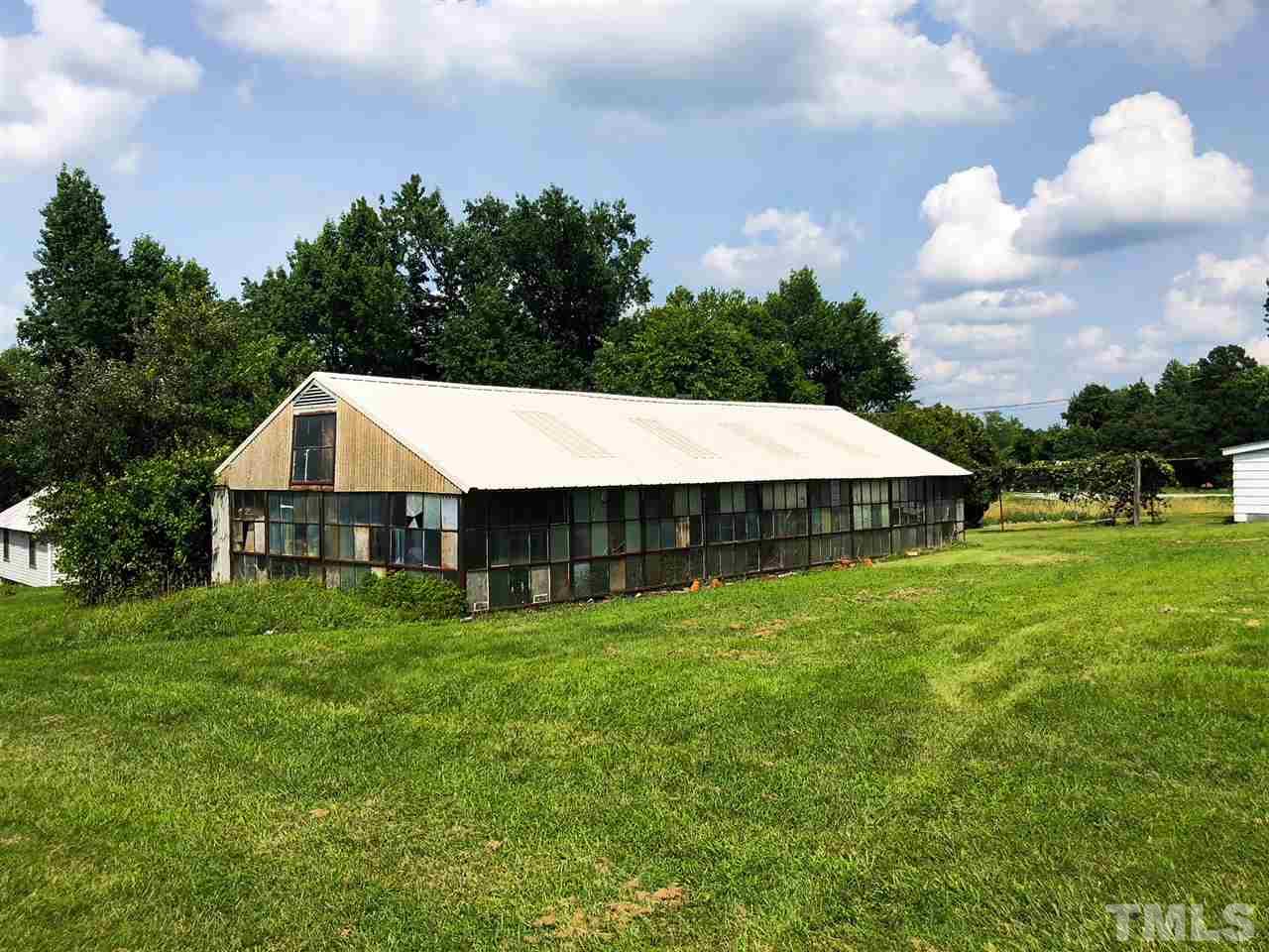 894 Shiloh Church Road Roxboro, NC 27574 - Photo 22 of 24 a view of a house with a yard