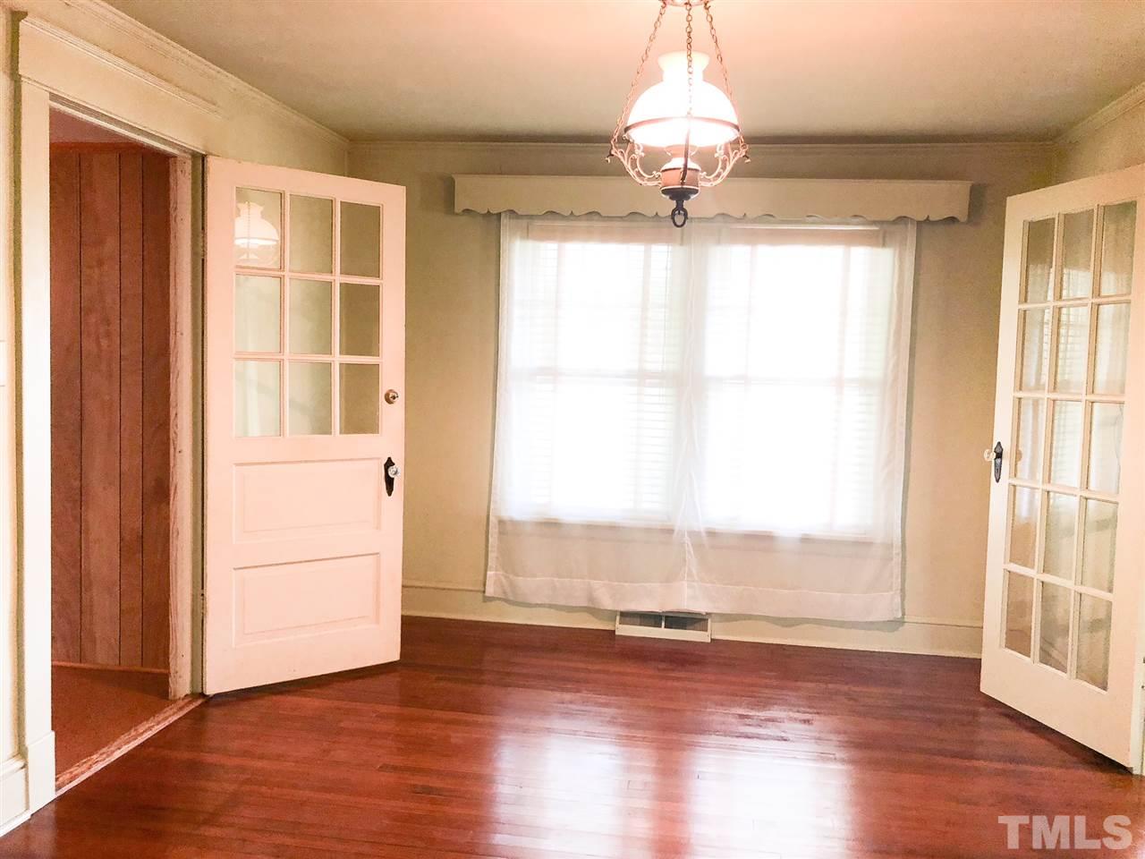 894 Shiloh Church Road Roxboro, NC 27574 - Photo 6 of 24 a view of a room with wooden floor and a large window