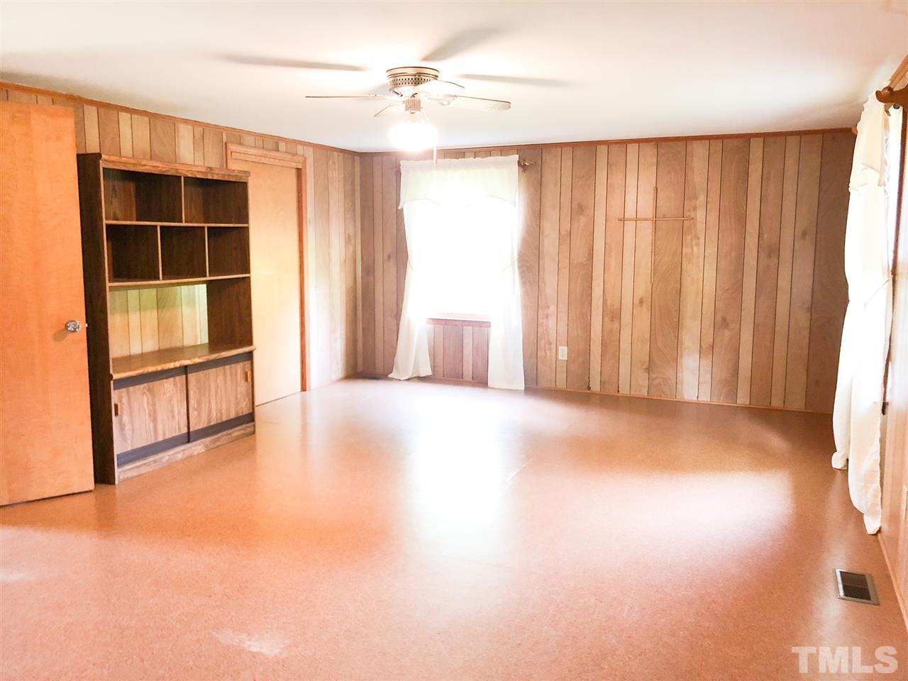 894 Shiloh Church Road Roxboro, NC 27574 - Photo 9 of 24 a view of an empty room with a window