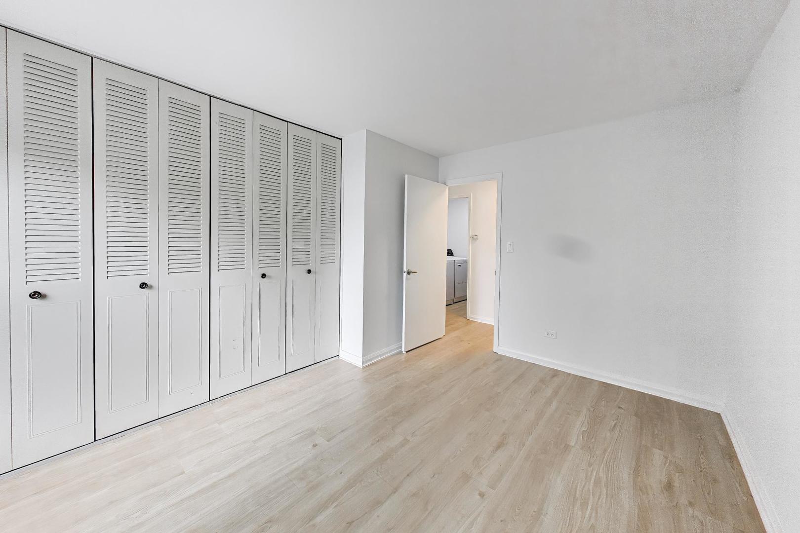 958 Inverrary Lane, Unit 958 Deerfield, IL 60015 - Photo 9 of 14 a view of an empty room with wooden floor