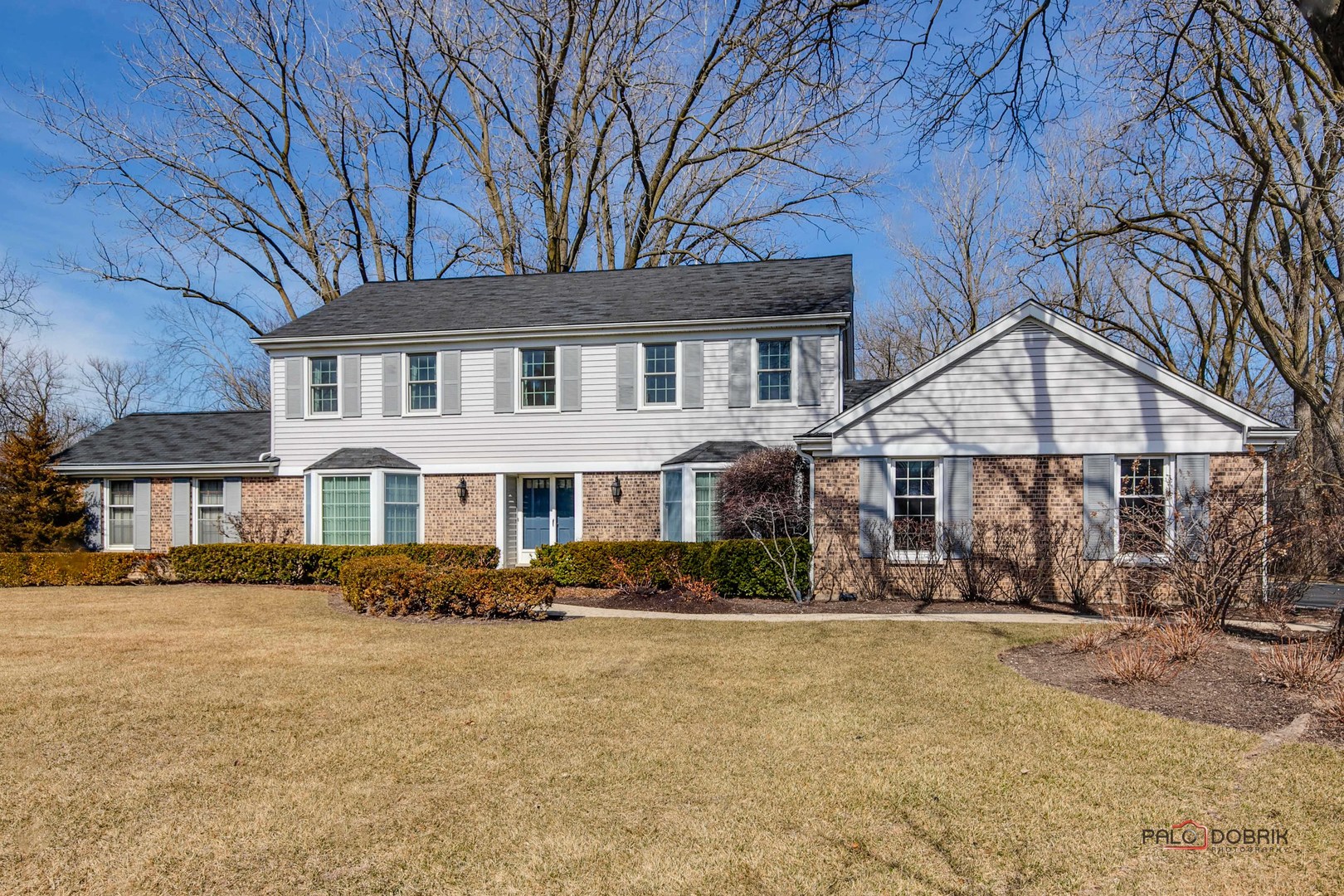 950 Old Mill Road Lake Forest, IL 60045 - Photo 1 of 59 a front view of a house with a yard