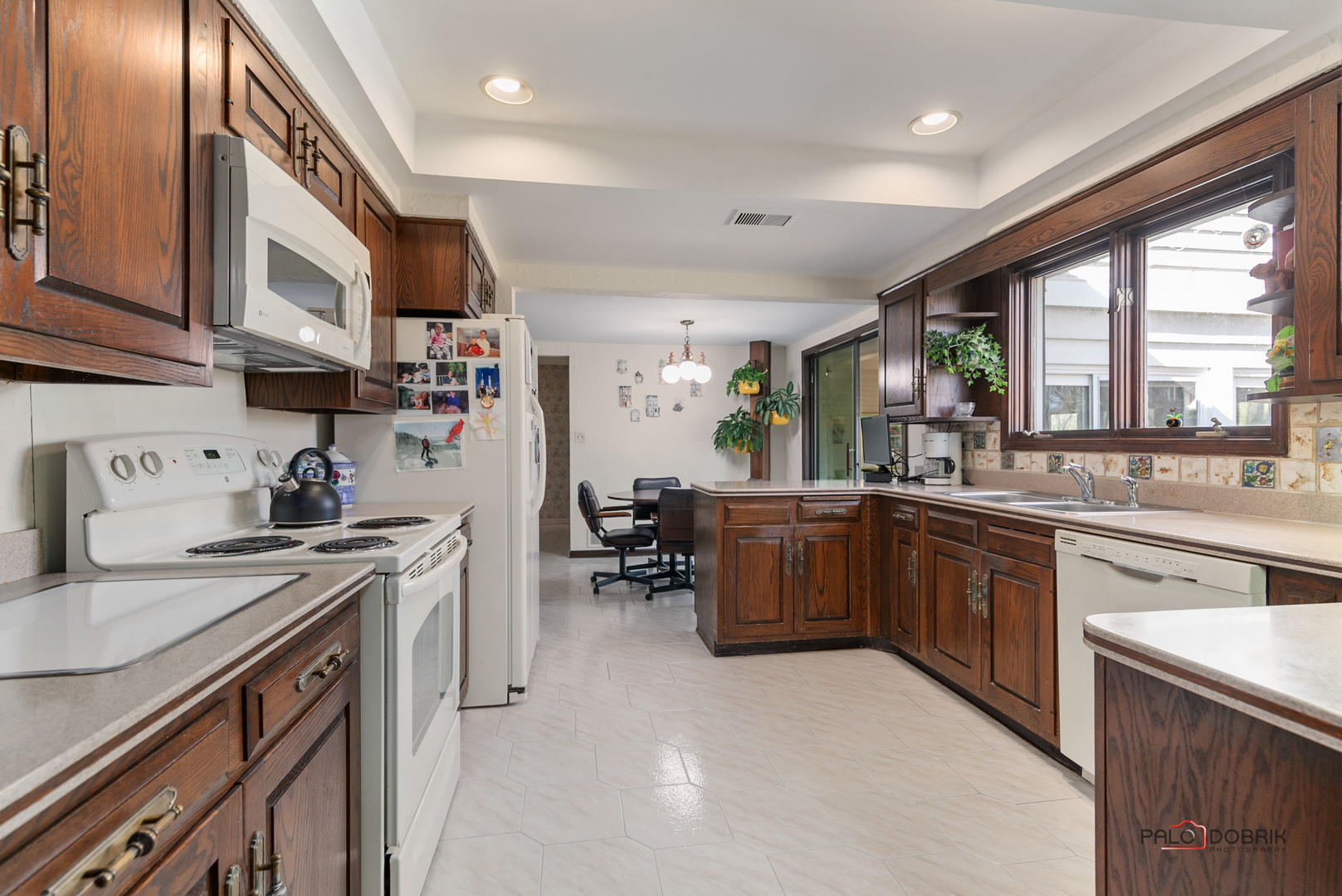 950 Old Mill Road Lake Forest, IL 60045 - Photo 15 of 59 a kitchen with a sink stove and cabinets