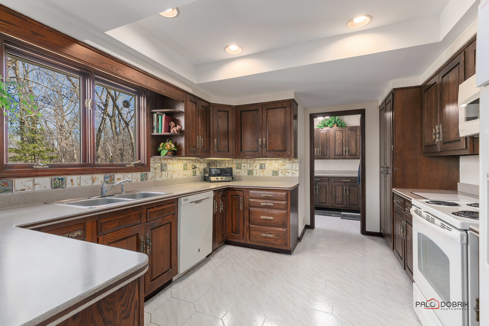 950 Old Mill Road Lake Forest, IL 60045 - Photo 17 of 59 a kitchen with a sink stove and cabinets