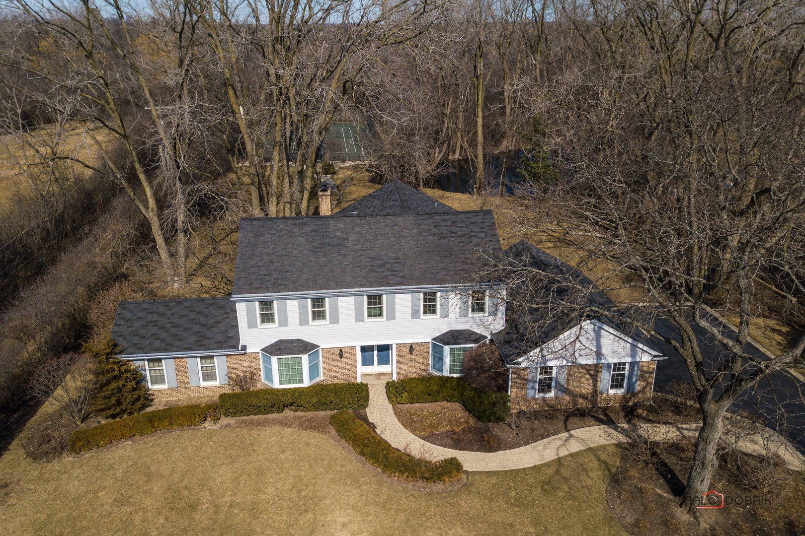 950 Old Mill Road Lake Forest, IL 60045 - Photo 2 of 59 a front view of a house with yard and trees