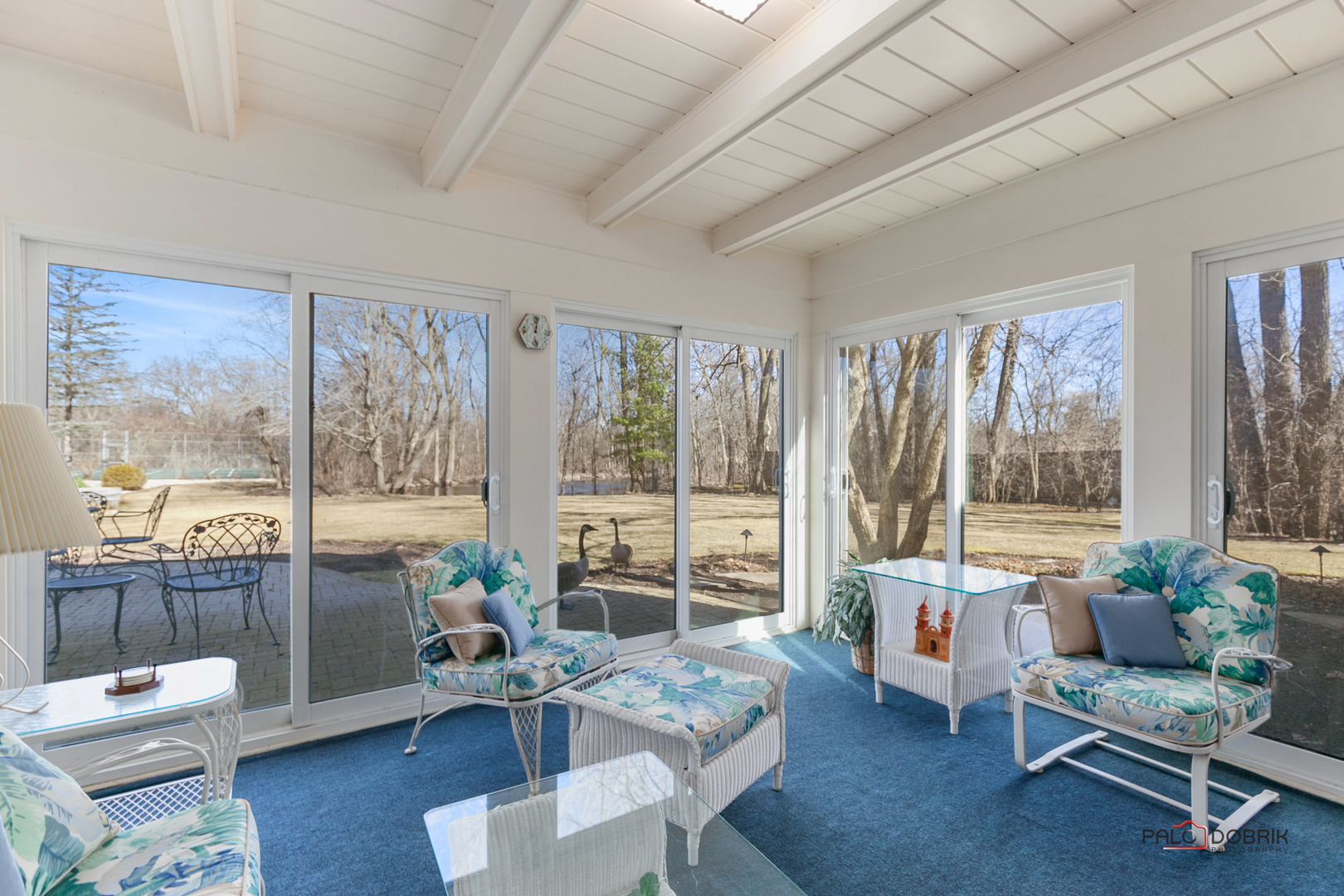 950 Old Mill Road Lake Forest, IL 60045 - Photo 21 of 59 a living room with furniture and a floor to ceiling window