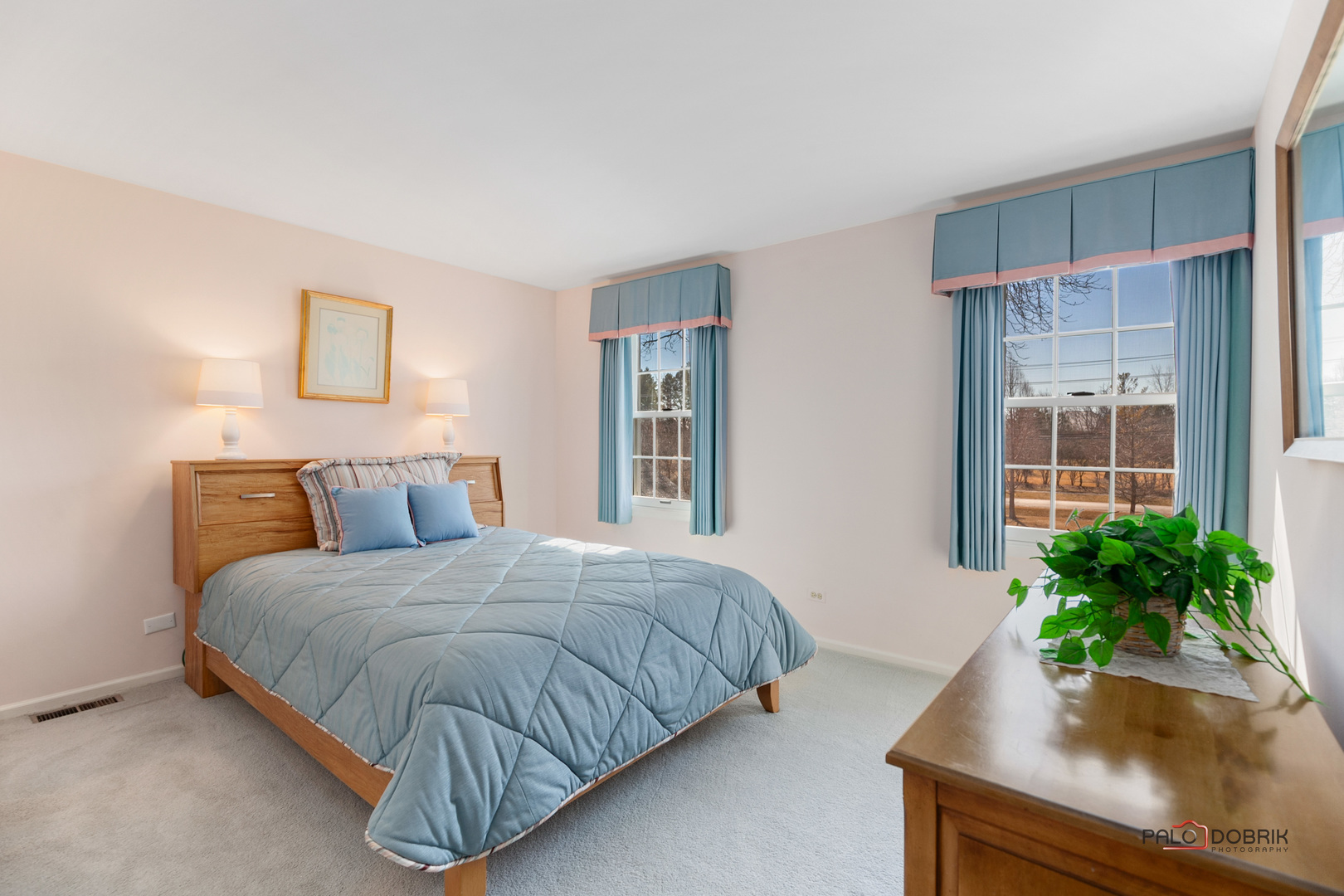 950 Old Mill Road Lake Forest, IL 60045 - Photo 23 of 59 a bedroom with a bed and potted plant