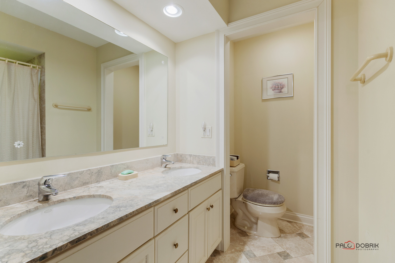 950 Old Mill Road Lake Forest, IL 60045 - Photo 24 of 59 a bathroom with a granite countertop sink a toilet and a mirror