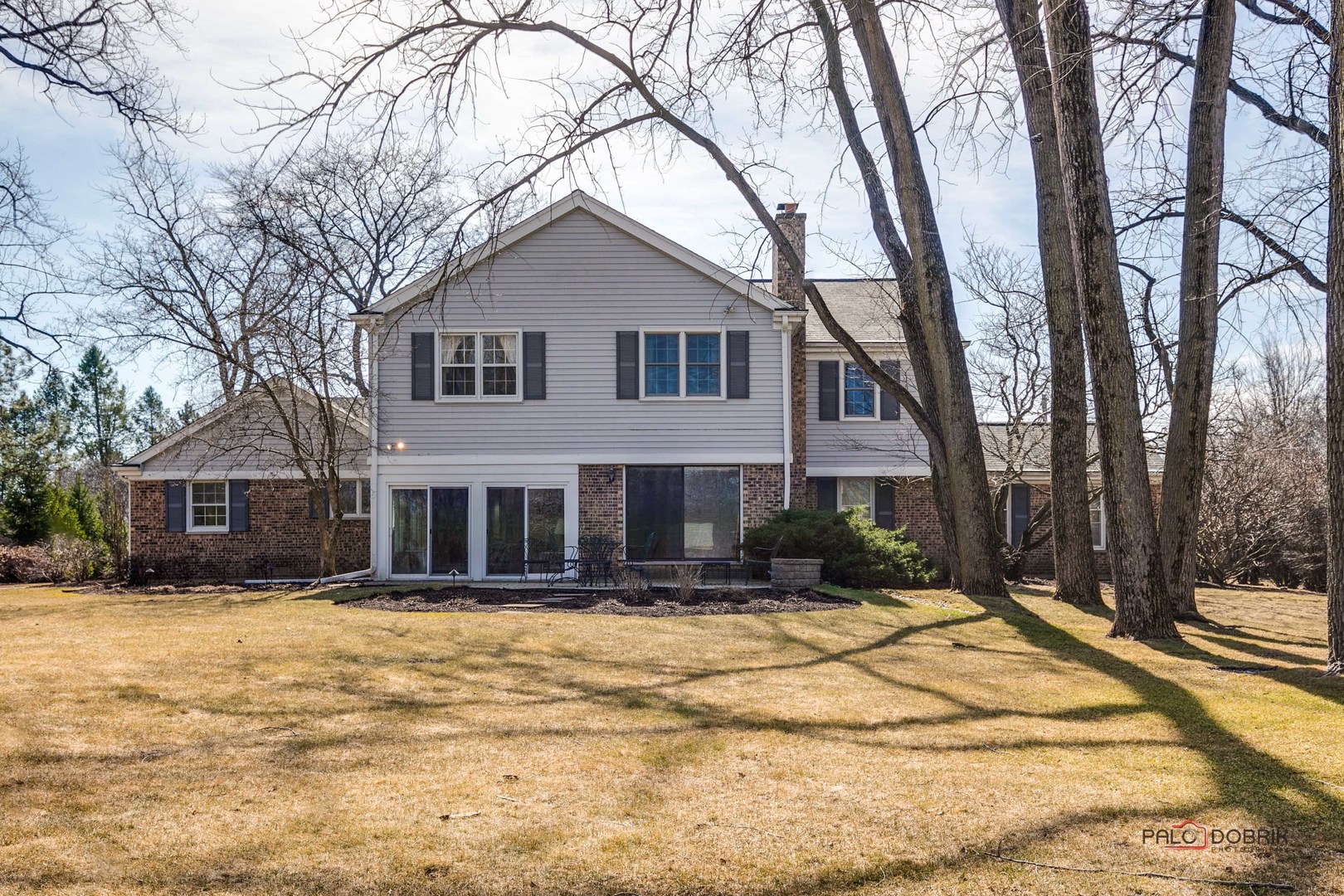 950 Old Mill Road Lake Forest, IL 60045 - Photo 35 of 59 a front view of residential houses with yard and trees