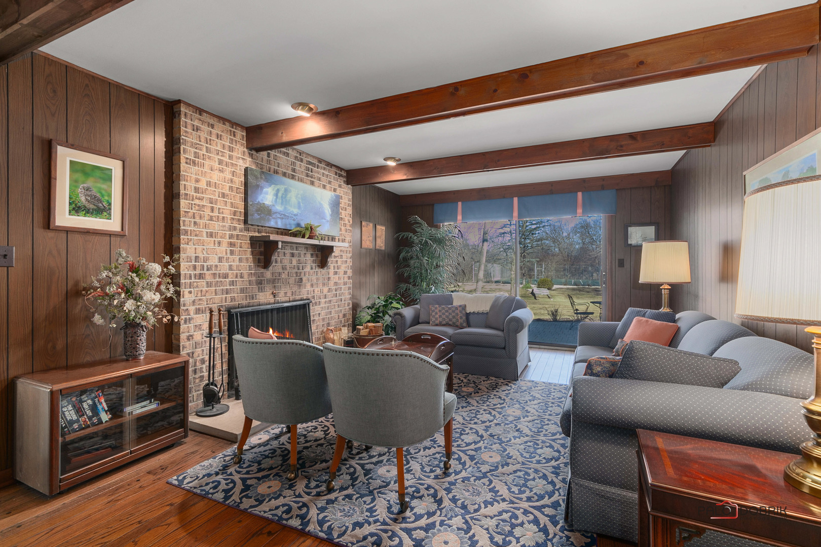 950 Old Mill Road Lake Forest, IL 60045 - Photo 10 of 59 a living room with furniture a fireplace and a table