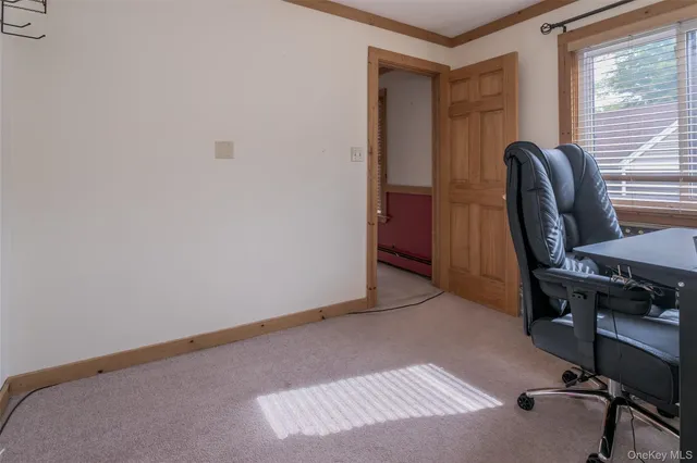 a workspace with furniture and window