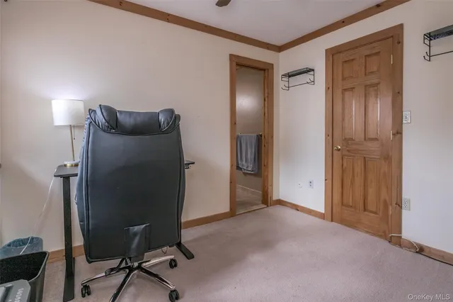 a view of a livingroom with a workspace