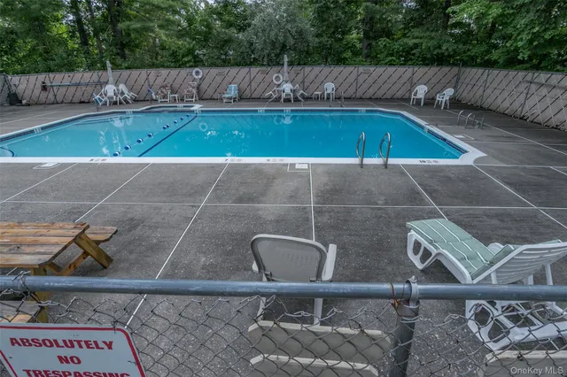 a view of small pool and deck