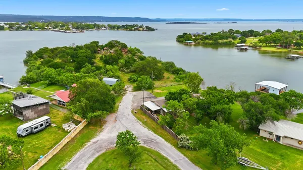 a view of a lake with a building in the background