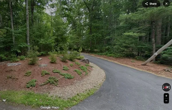 a view of a backyard with green space