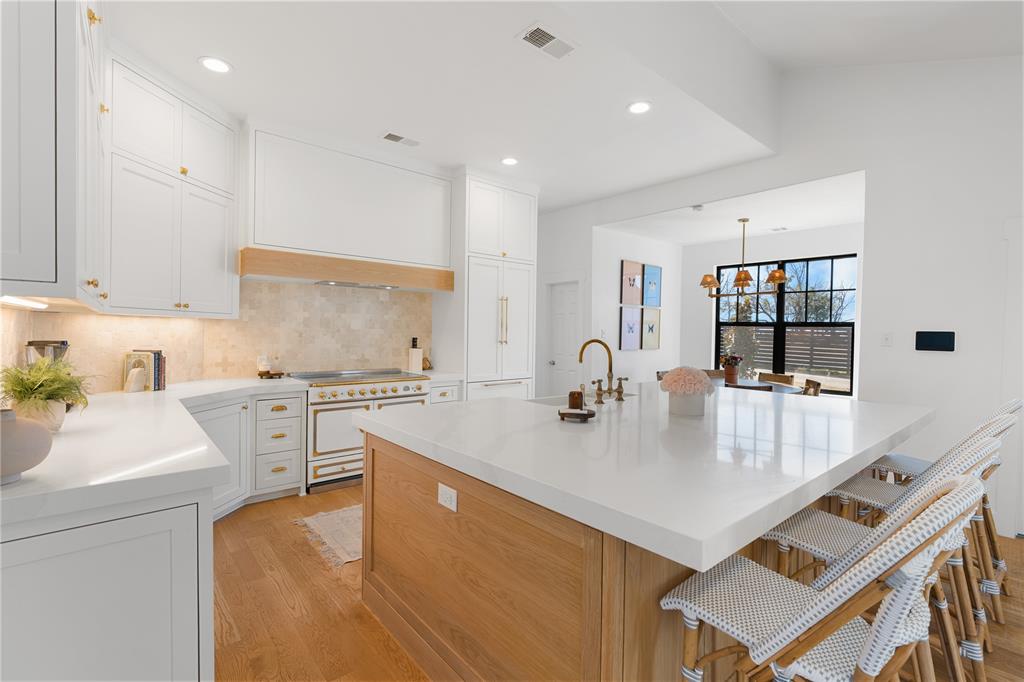 990 Cornelius Road Rockwall, TX 75087 - Photo 14 of 37 a kitchen with a sink a stove and chairs