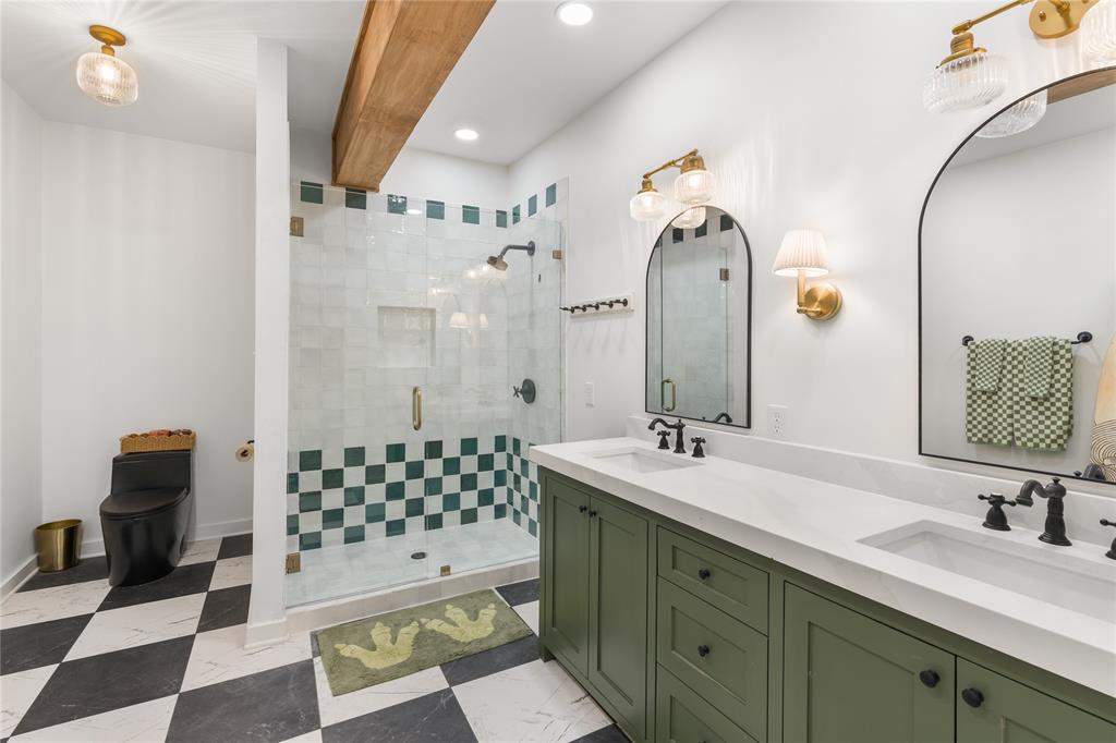 990 Cornelius Road Rockwall, TX 75087 - Photo 27 of 37 a bathroom with a double vanity sink mirror and shower