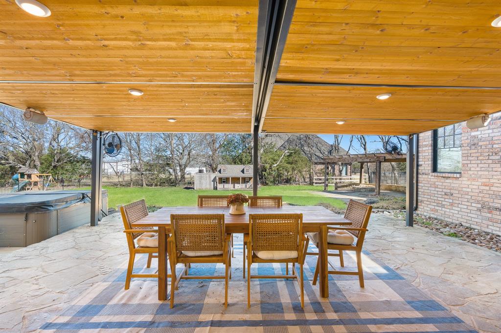 990 Cornelius Road Rockwall, TX 75087 - Photo 34 of 37 a view of a patio with a table chairs and a table
