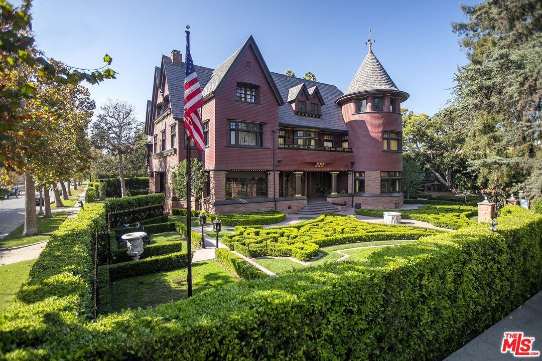 357 Lorraine Boulevard Los Angeles, CA 90020 - Photo 1 of 34 a front view of a house with swimming pool having outdoor seating