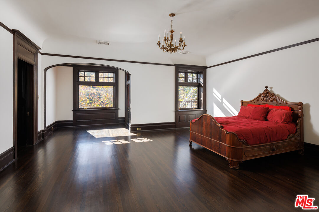 357 Lorraine Boulevard Los Angeles, CA 90020 - Photo 20 of 34 a living room with hard wood floors and a window