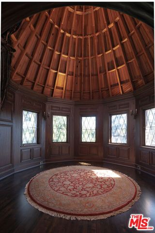 a view of a porch with wooden floor and stairs