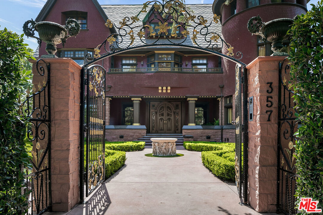 357 Lorraine Boulevard Los Angeles, CA 90020 - Photo 3 of 34 a front view of a house with a garden and plants