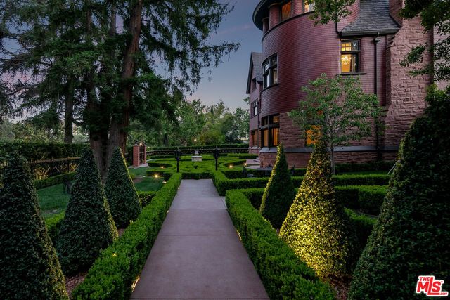 a front view of building with yard