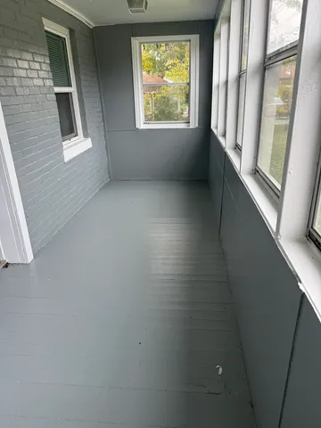 a view of an empty room with a window