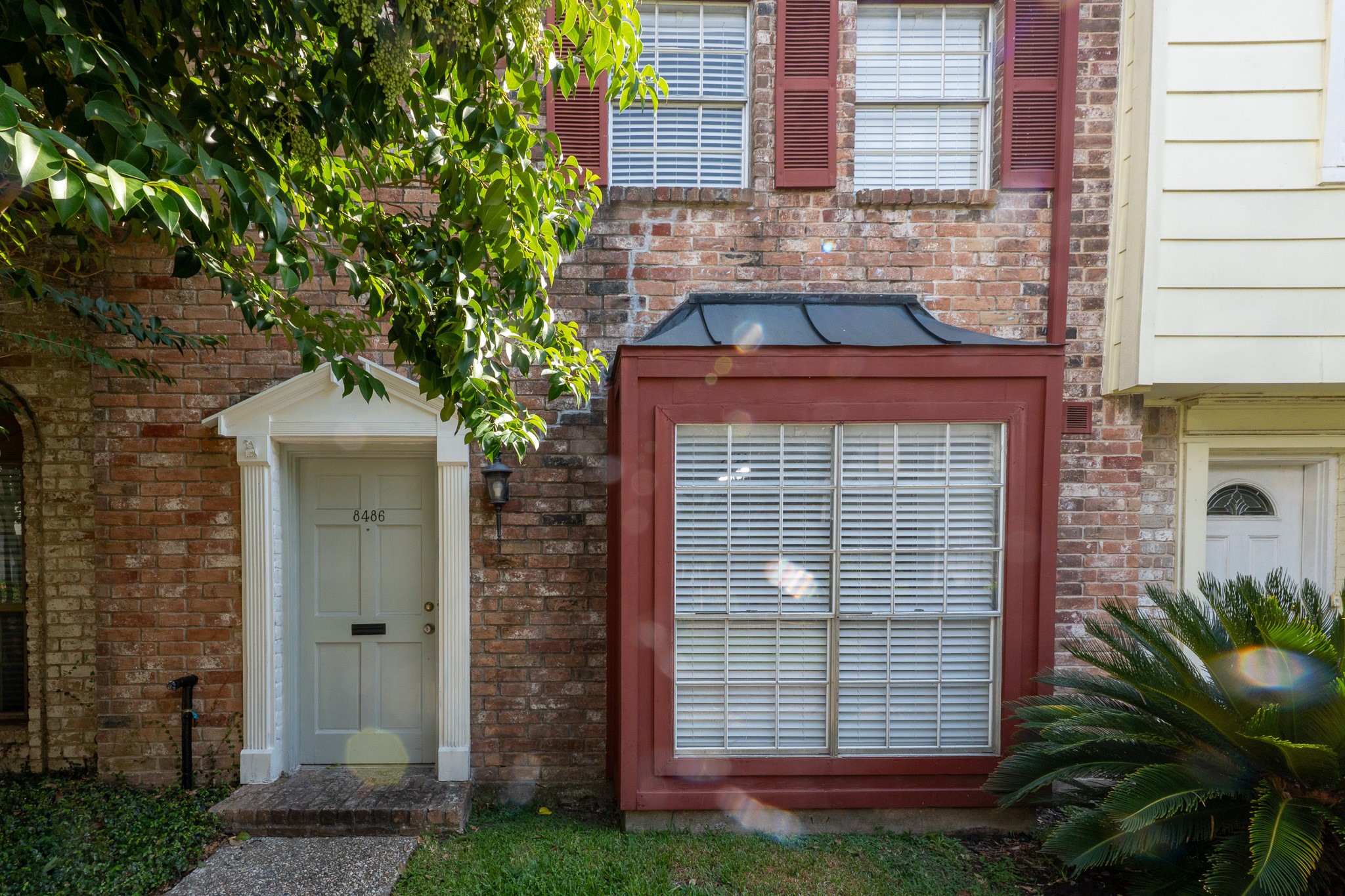 8486 Ariel Street Houston, TX 77074 - Photo 13 of 45 a front view of a house with a yard